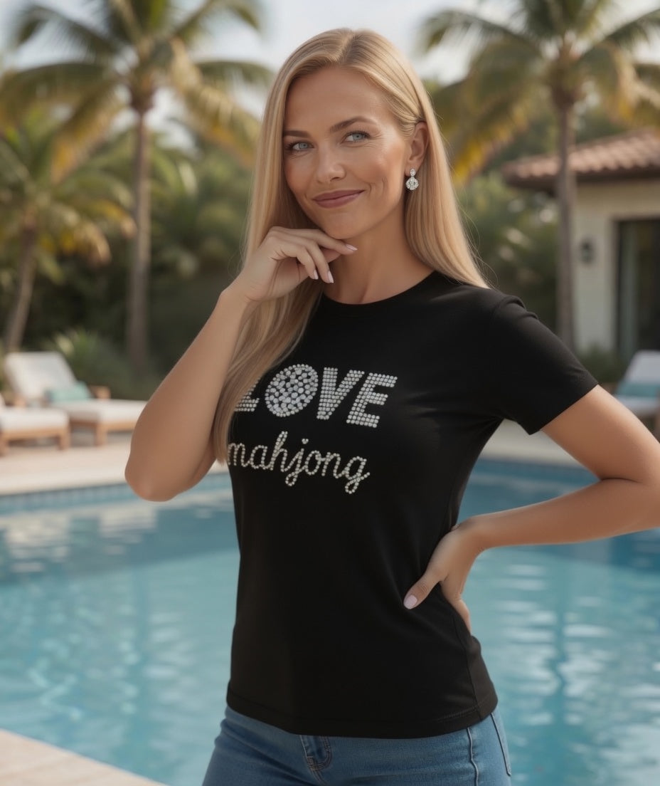Woman wearing LOVE Mahjong in Black short sleeve tee by the pool.