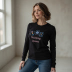 Woman wearing a black long-sleeve shirt with 'Mahjong Queen' text and symbols in a room with natural light.