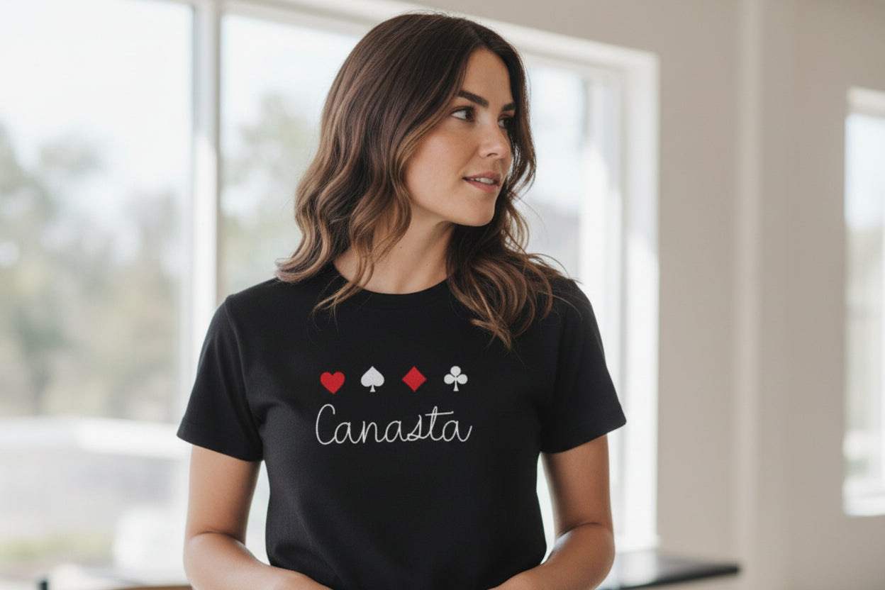 Woman wearing a black t-shirt with Canasta design indoors