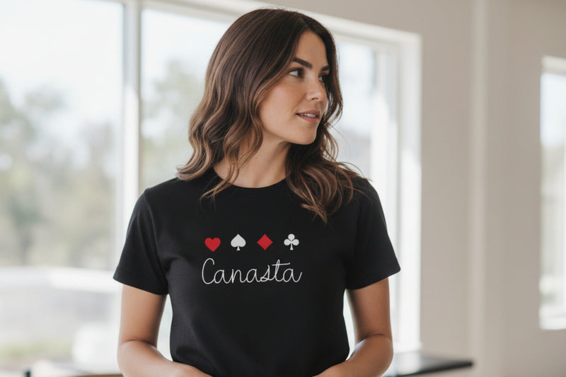 Woman wearing a black t-shirt with Canasta design indoors