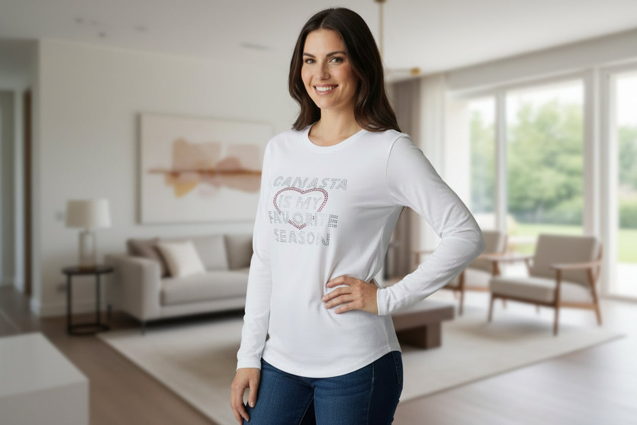 Woman wearing a white t-shirt with 'Canasta is my favorite season' text