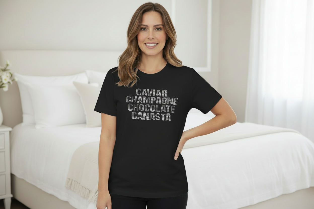 Woman wearing a black t-shirt with text in a bedroom setting