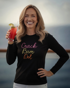Woman holding a drink with a scenic background, she is wearing a black long sleeve with crack bam dot design for mahjong tops