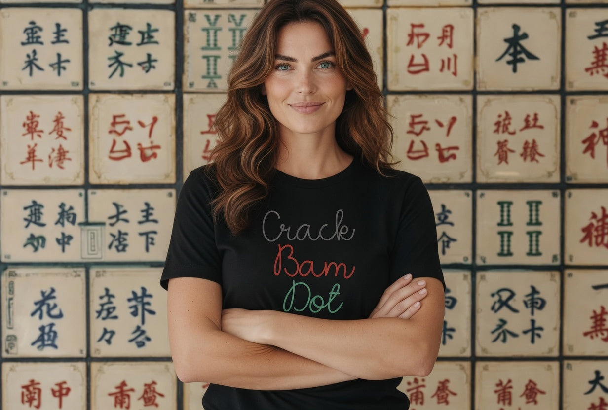 Woman wearing a white t-shirt with 'Crack Bam Dot' text in front of a wall with Chinese characters.