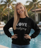 Women wearing LOVE Mahjong white sweatshirt by the pool