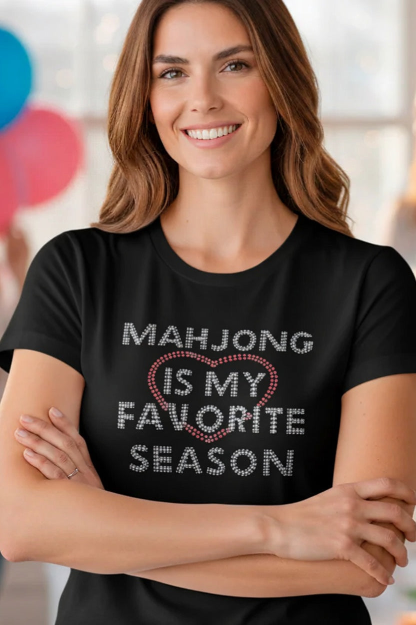 Woman wearing a black t-shirt with 'Mahjong is my favorite season' text.
