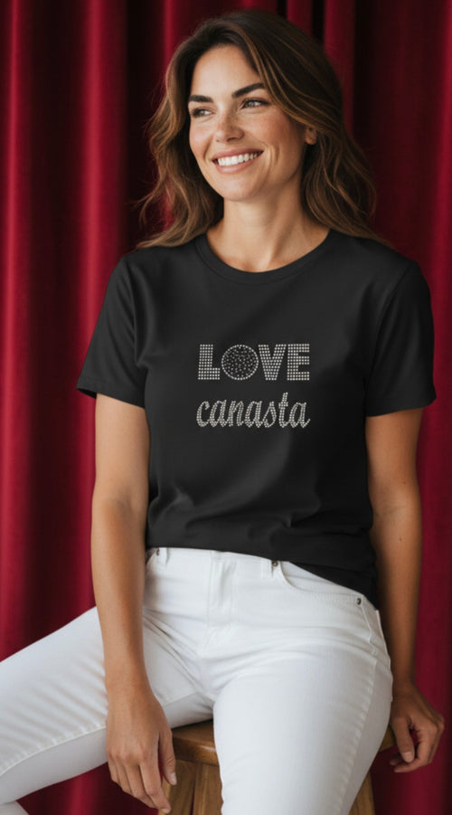 Woman wearing a black t-shirt with 'LOVE canasta' text against a red curtain background